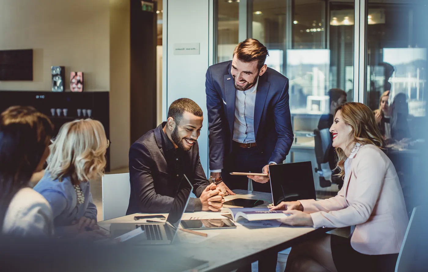Colleagues around a conference table in a law firm office.